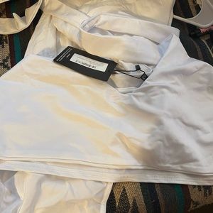 Beautify her white bikini three piece